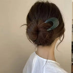 A woman’s U-shape Arenzza hairpins clipped into her hair, showcasing stylish hair accessories for women.