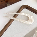 A pair of Arenzza U-shape women’s hairpins with sleek metallic finish, designed for stylish hair styling and accessories.