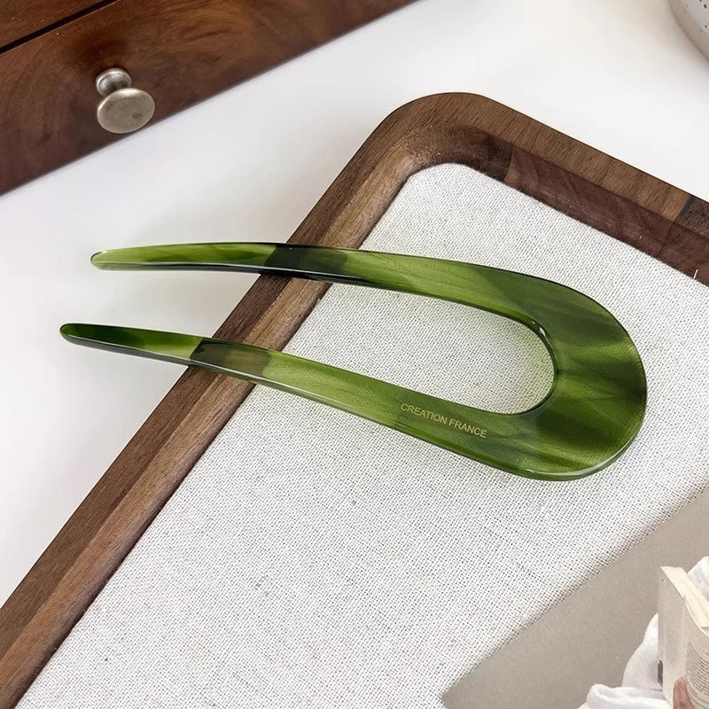 A pair of U-shape women hairpins by Arenzza, stylish hair clips made of metal, perfect for securing and accessorizing hair styles.
