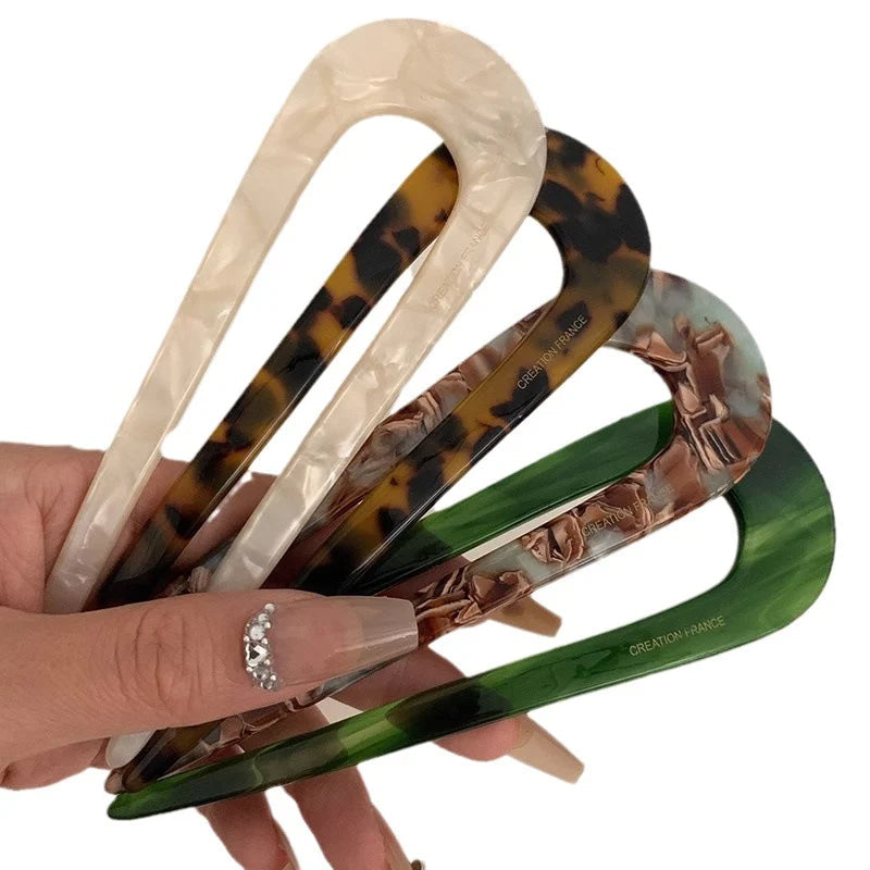 A pair of U-shaped women’s hairpins from Arenzza, stylish hair clips with a sleek design suitable for hair styling accessories.