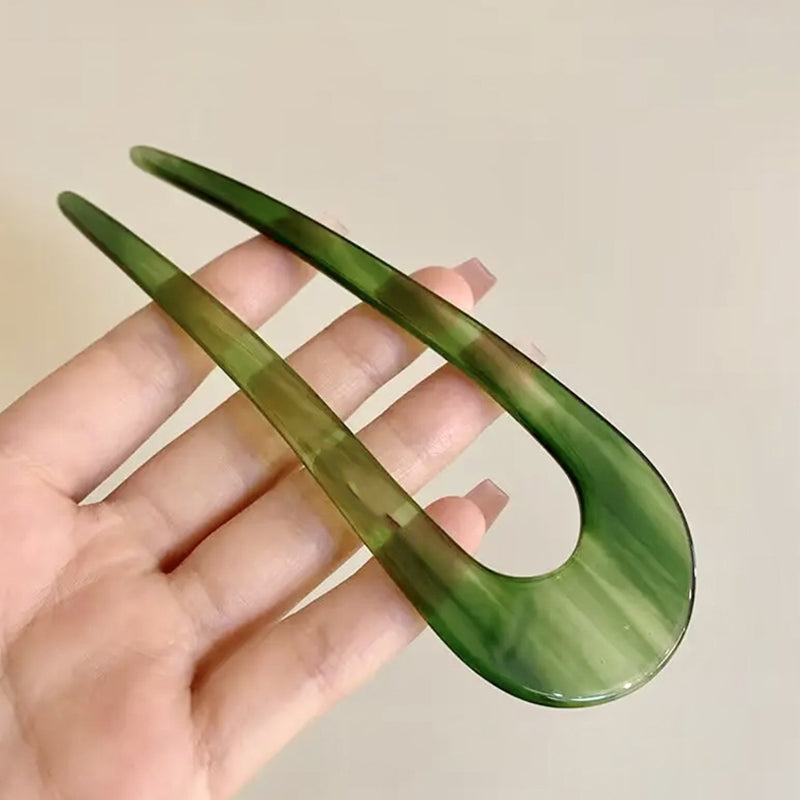 A pair of U-shape women hairpins and hair clips from Arenzza, styled for securing hair in a casual or elegant look.