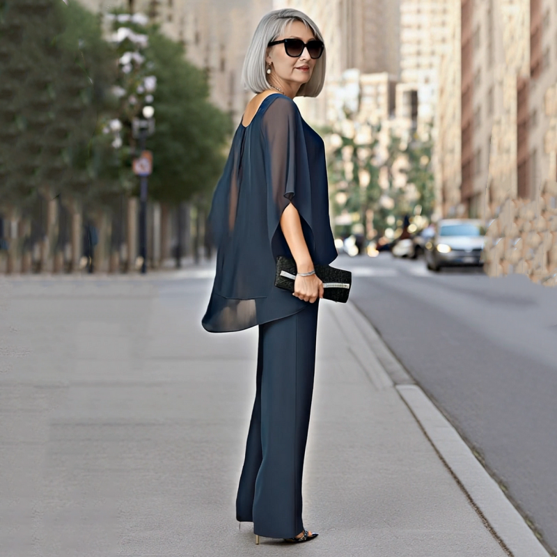 A women’s irregular chiffon top and wide-leg pants 2-piece set by Arenzza, featuring flowy fabric and stylish, relaxed fit.
