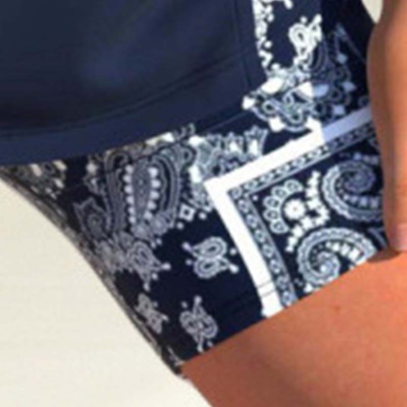 Arenzza athletic two-piece swimsuit with criss-cross neckline, quick-dry fabric, inclusive sizing, featuring a modest tank top and sporty boy shorts.