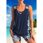 Arenzza athletic two-piece swimsuit with criss-cross neckline, quick-dry fabric, modest tank top, and sporty boy shorts on a model.