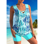 Arenzza athletic two-piece swimsuit with criss-cross neckline, quick-dry fabric, modest tank top, and sporty boy shorts on a model.