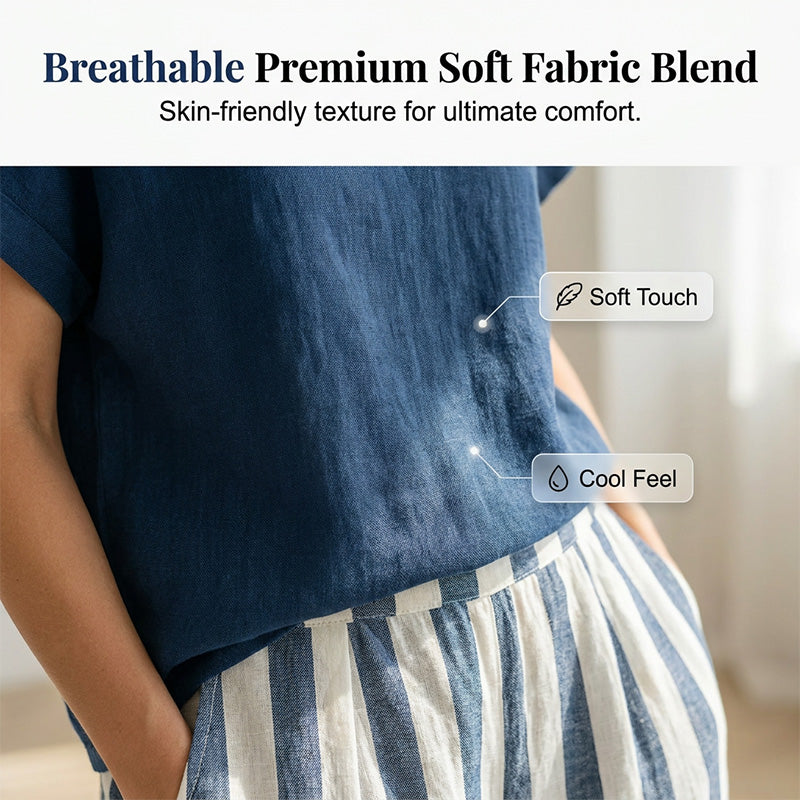 A woman wearing a casual solid top and striped wide-leg pants from Arenzza, perfect for effortless weekend style.