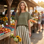 A woman wearing Arenzza casual solid top and striped wide-leg pants, showcasing effortless weekend style and comfortable clothing.