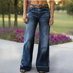 A woman wearing Arenzza women's retro flare jeans with pockets, showcasing the stylish high-waisted denim pants and flared leg design.