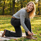 A pair of women's retro flare jeans by Arenzza with front pockets, styled with casual clothing on a model.