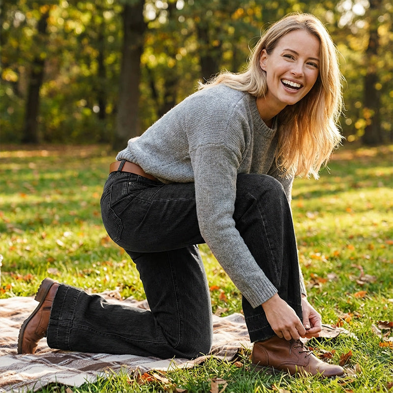 A pair of women's retro flare jeans by Arenzza with front pockets, styled with casual clothing on a model.