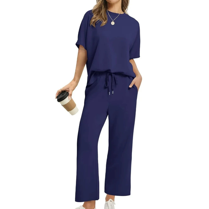 A woman wearing Arenzza women's soft casual top and pants set, featuring a comfortable, stylish clothing ensemble.