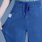 A pair of Arenzza high waist ultra-stretch mom jeans showing the fit and style in a casual clothing setting