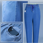 A pair of high waist ultra-stretch mom jeans by Arenzza, showcasing their fit and denim texture on a plain background.