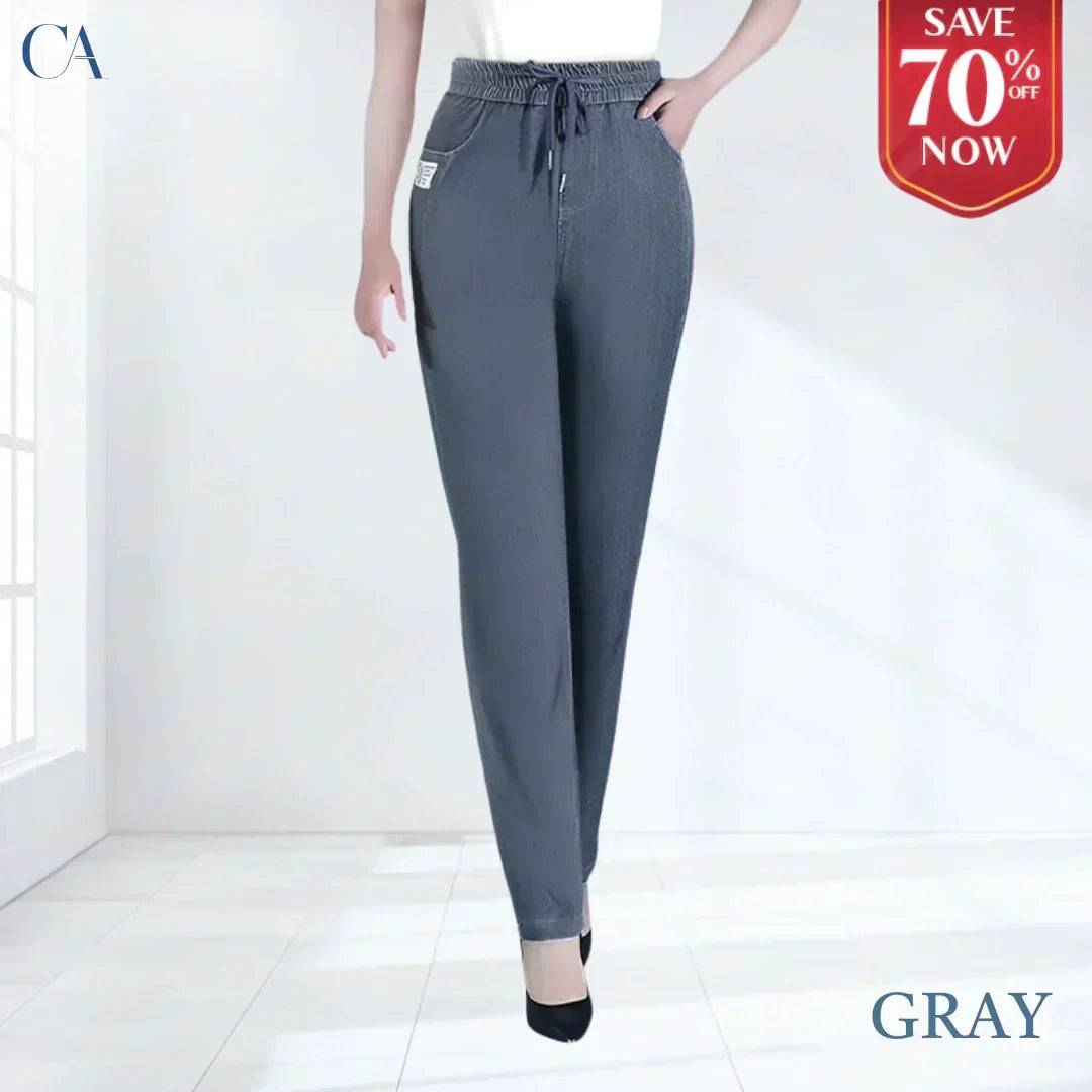 A pair of high waist ultra-stretch mom jeans from Arenzza, showcased in a stylish pose highlighting the fit and denim fabric.