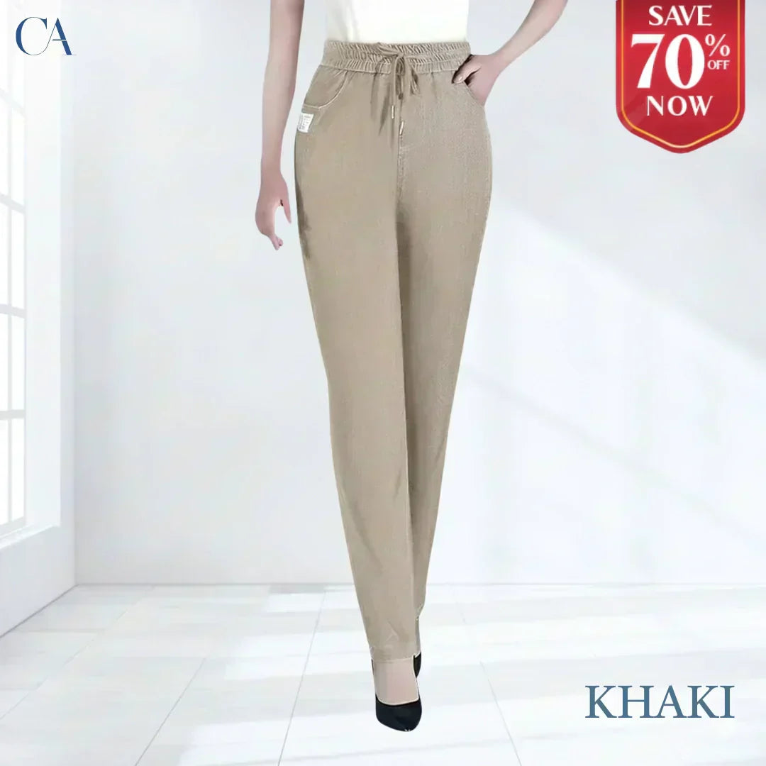 A pair of high waist ultra-stretch mom jeans by Arenzza, displayed on a hanger showing fitting details and classic denim style.
