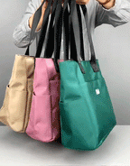 Aarenza large capacity water-repellent nylon shoulder bag with multiple pockets, designed for versatile carrying and outdoor use.