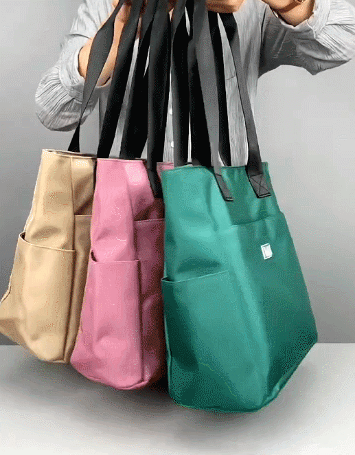 Aarenza large capacity water-repellent nylon shoulder bag with multiple pockets, designed for versatile carrying and outdoor use.