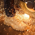 A pair of industrial-grade Arenzza safety shoes with anti-slip soles, puncture resistance, and heat-resistant features for work safety.