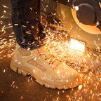 A pair of industrial-grade Arenzza safety shoes with anti-slip soles, puncture resistance, and heat-resistant features for work safety.