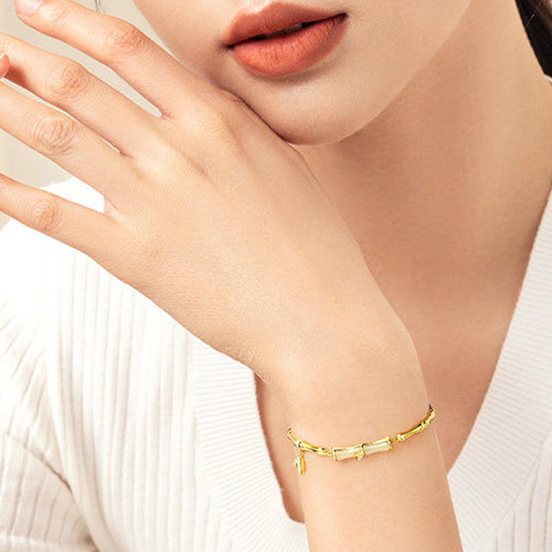 Aarenzza Hetian Jade Bamboo Bracelet featuring green jade beads and bamboo-shaped design, jewelry accessory for stylish wear.