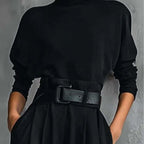 A women’s elegant turtleneck top and high-waist pants set by Arenzza, featuring a fitted turtleneck and stylish high-waist trousers.