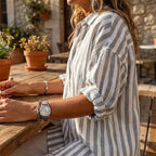 Women's casual striped pullover shirt by Arenzza, featuring a comfortable fit and stylish design, displayed on a hanger.