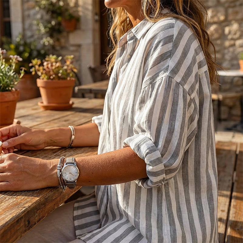 Women's casual striped pullover shirt by Arenzza, featuring a comfortable fit and stylish design, displayed on a hanger.