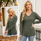 A women's V-neck long sleeve solid sweater from Arenzza in warm autumn colors, displayed on a hanger.