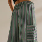 Women's striped wide-leg drawstring pants by Arenzza, featuring a comfortable fit and stylish design, shown on a model.