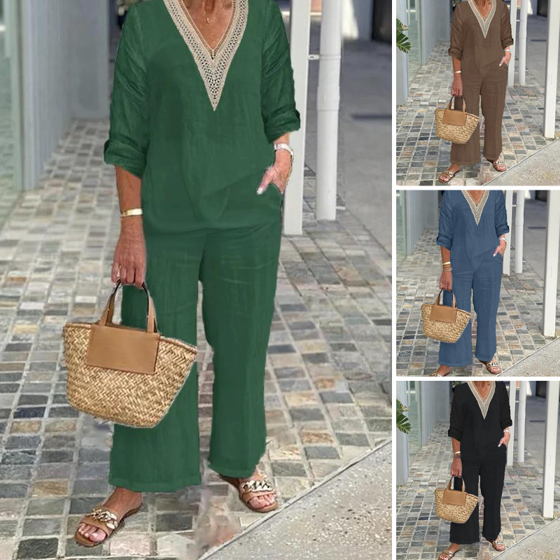 A woman wearing a women's V-neck top and wide-leg pants by Arenzza, showcasing a stylish, comfortable clothing outfit.