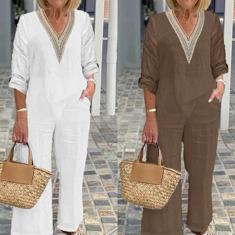 A woman wears a stylish Arenzza women's V-neck top and wide-leg pants, showcasing a comfortable, elegant clothing outfit.