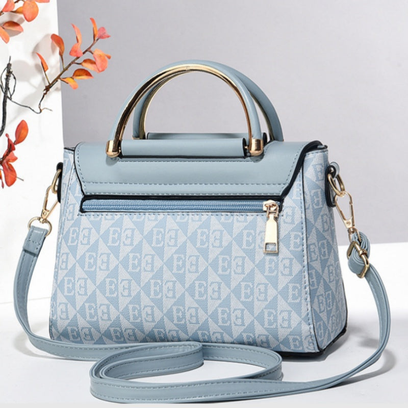 Women's elegant black PU leather crossbody bag by Arenzza with gold-tone hardware and adjustable strap.