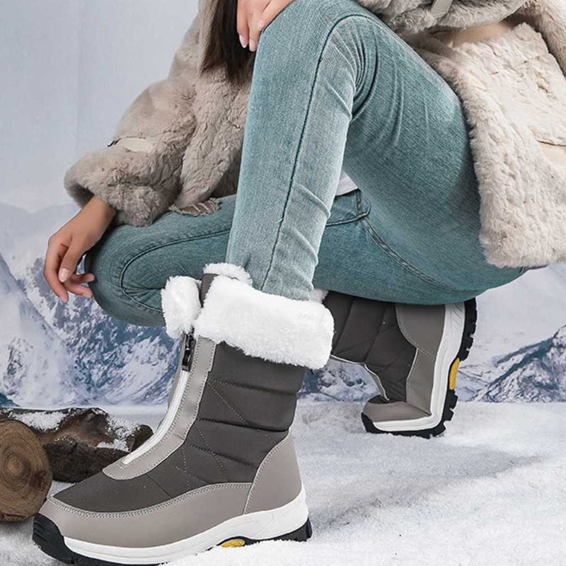 A pair of Arenzza women's non-slip warm zipper snow boots with cozy lining and rugged soles for winter wear.