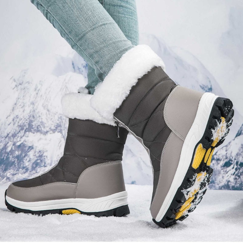 A pair of Arenzza women's non-slip warm zipper snow boots with thick soles and cozy lining, suitable for winter snow conditions.