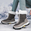 A pair of Arenzza women's non-slip warm zipper snow boots with cozy lining, suitable for winter outdoor wear.