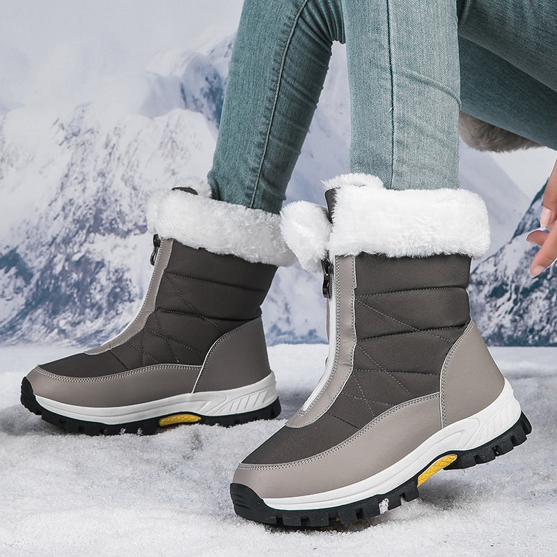 A pair of Arenzza women's non-slip warm zipper snow boots with cozy lining, suitable for winter outdoor wear.
