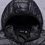 Men's warm quilted puffer jacket by Arenzza with a hood, featuring a sleek design and insulated for cold weather.