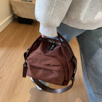 Aarenza women's lightweight nylon crossbody handbag in black with adjustable strap and sleek design.