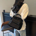 A women’s lightweight nylon crossbody handbag by Arenzza with a sleek design and adjustable strap, perfect for everyday use.