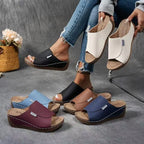 A pair of women's casual wedge slide sandals by Arenzza with open toes and comfortable wedge heels, perfect for summer wear.