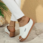 A pair of Arenzza women's casual wedge slide sandals with open toes and beige straps on a neutral background.
