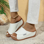 Women's casual wedge slide sandals by Arenzza featuring tan straps and comfortable platform design.