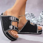 A pair of Arenzza double buckle cork slide sandals with sparkling straps, perfect for summer and beachwear.