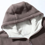 A men's double-faced thick warm hooded jacket by Arenzza, showcasing its cozy, insulated design and soft fabric in a winter setting.