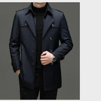 A men's medium-length trench coat by Arenzza with a detachable inner lining, shown in a neutral color on a hanger.