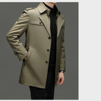 Men's medium-length trench coat with detachable inner from Arenzza, shown on a model, featuring classic design and weather-resistant fabric.
