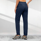 A pair of Arenzza women's hiking pants with five zipper pockets, quick-drying fabric, tailored for outdoor adventure.