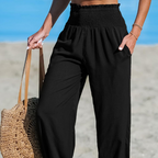 A pair of women's smocked high waist harem pants by Arenzza, featuring a relaxed fit and lightweight summer fabric.