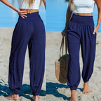 Women’s smocked high waist harem pants by Arenzza, featuring a relaxed fit and summer-ready style in the image.