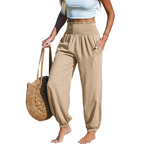 A pair of Arenzza women's smocked high waist harem pants in lightweight fabric, perfect for effortless summer comfort.